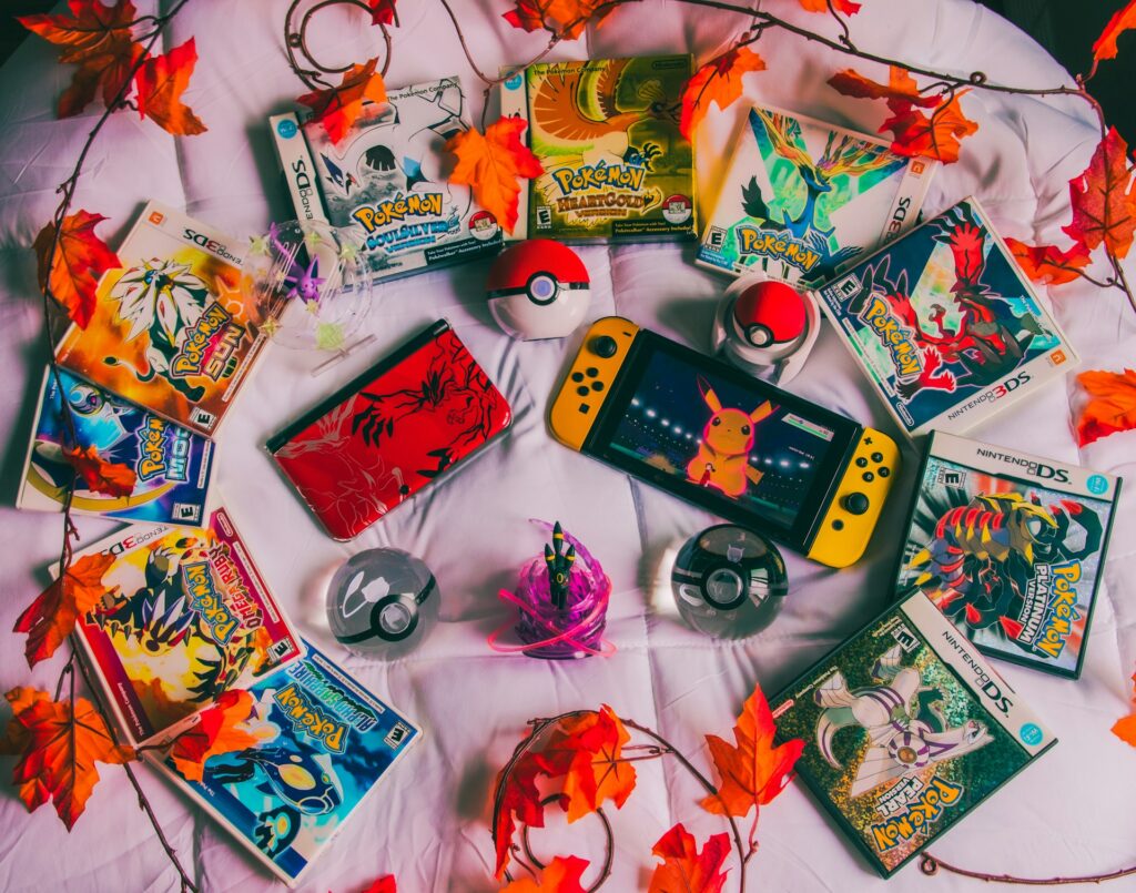 Pokémon game collection with Nintendo Switch, Poké Balls, and classic titles arranged in aesthetic flat lay