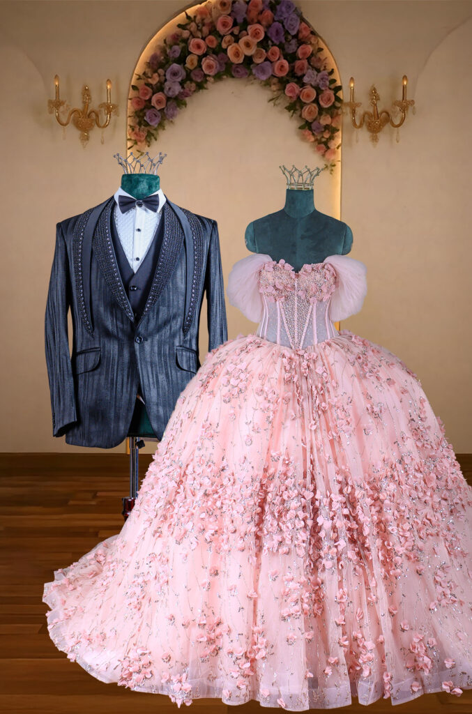 Blush pink floral appliqué bridal gown paired with a charcoal grey embellished tuxedo, highlighting contemporary couture wedding fashion by La Fantaisie.